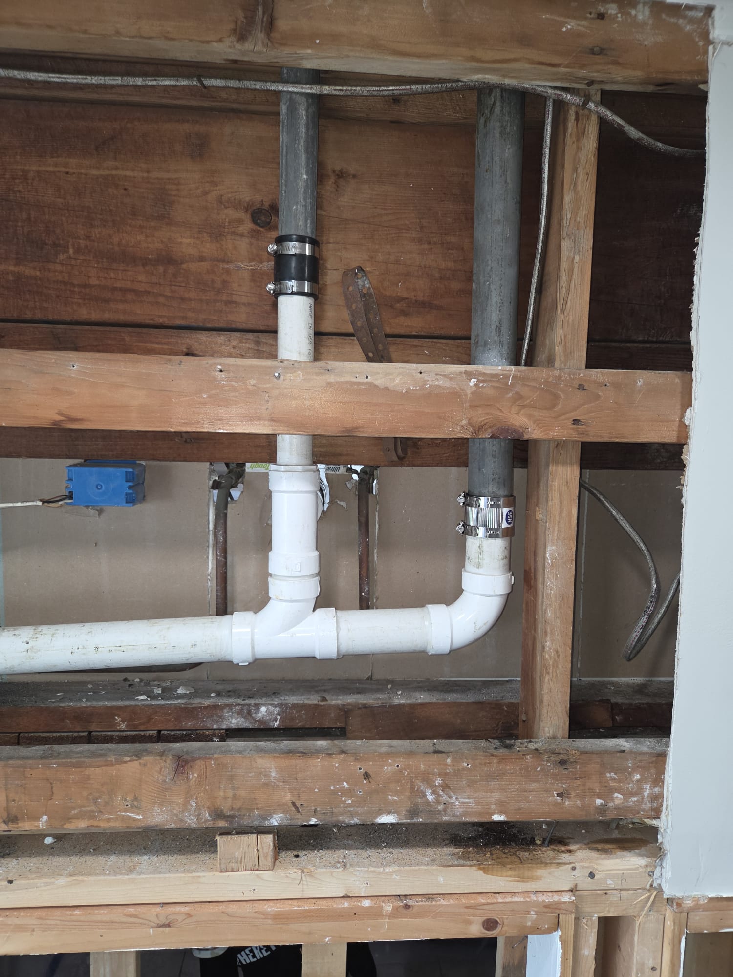 New PVC drain fitting after repair