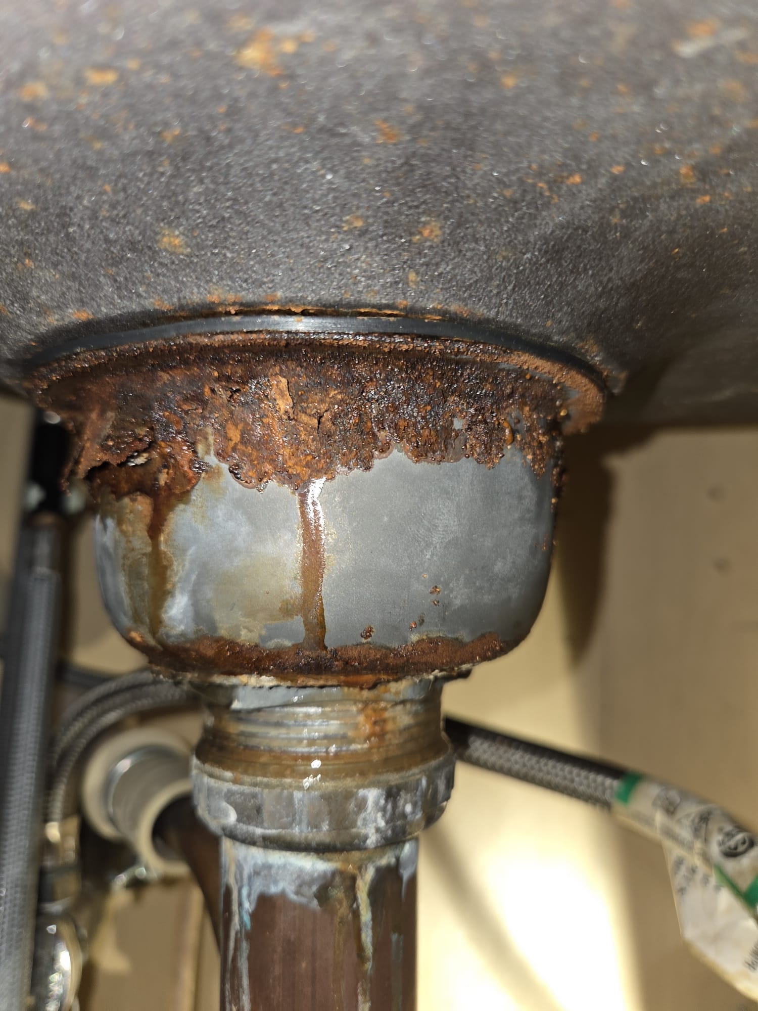 Old corroded sink strainer before replacement